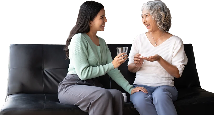 caretaker sitting with old person